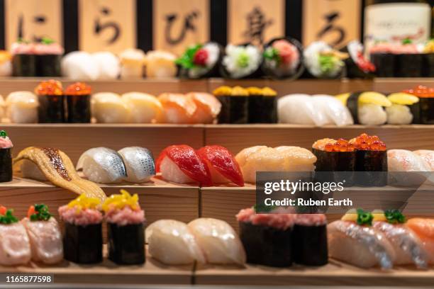 sushi stand on a restaurant - nigiri fotografías e imágenes de stock