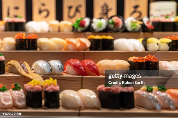 sushi stand on a restaurant - japanese food stock pictures, royalty-free photos & images