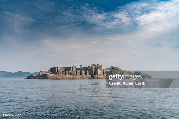 gunkanjima island (battleship island) near nagasaki - nagasaki kyushu stock pictures, royalty-free photos & images