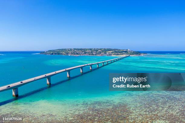 a long bridge to kouri island in okinawa - okinawa aerial stock pictures, royalty-free photos & images