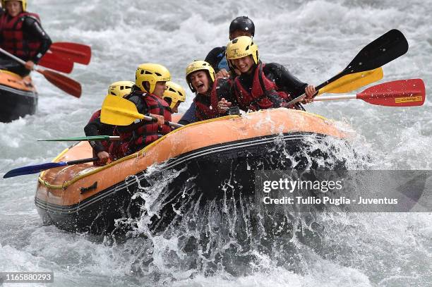 Players of Juventus Women ride in inlflatable boats as they do rafting down the Dora Baltea river on August 02, 2019 in Aymavilles near Aosta, Italy.