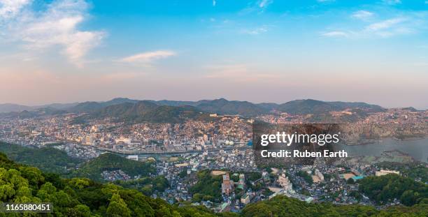 nagasaki cityscape from above during sunset - nagasaki kyushu stock pictures, royalty-free photos & images