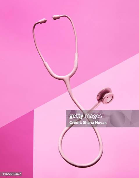 stethoscope painted pink for women's health awareness - womens issues stock-fotos und bilder