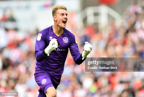 Joe Lumley of Queens Park Rangers celebrates after they score the first goal during the Sky Bet Championship match between Stoke City and Queens Park...