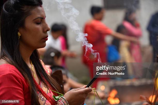 Nepalese Hindu devotees offering Fragrance sticks at the Rishishwor Mahadev Temple during Rishi Panchami Festival celebrations at Teku, Katmandu,...