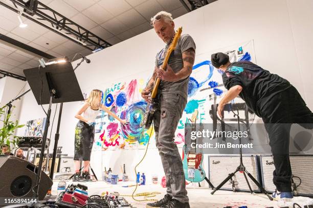 Artist Kate Neckel, guitarist and artist Mike McCready, and guitarist and artist Josh Klinghoffer of Infinite Color and Sound create live on stage...