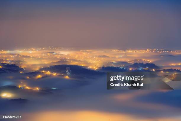 beauty city in the fog at midnight, the magical of light and fog - fantasy scene stock pictures, royalty-free photos & images