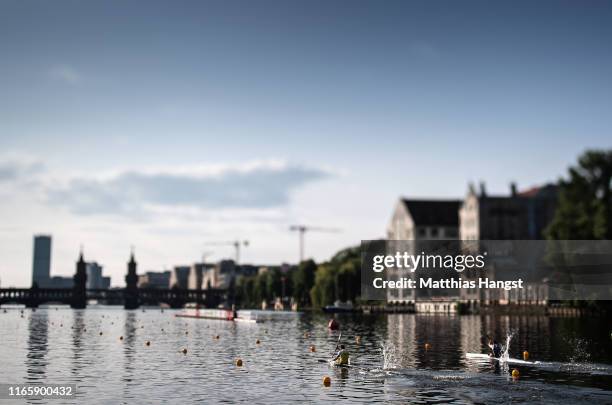 Athletes compete on the Spree river in front of the "Oberbaumbruecke" during the German Canoeing National Championships on August 03, 2019 in Berlin,...