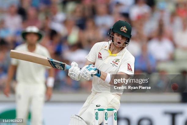 Steve Smith of Australia is struck on the helmet by a delivery from Ben Stokes of England during day three of the 1st Specsavers Ashes Test between...