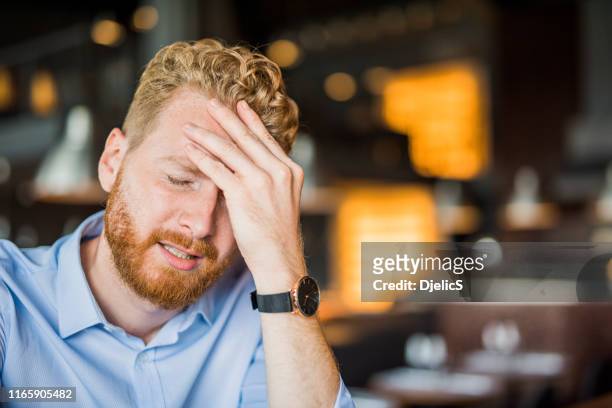 young man facing regret. - upset man stock pictures, royalty-free photos & images