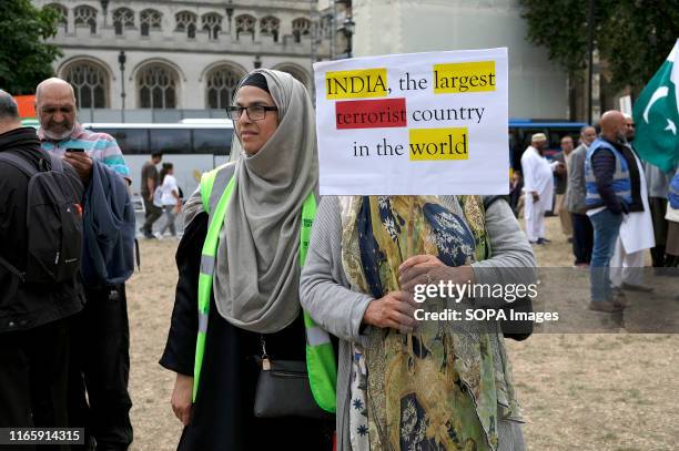 Protester holds a placard during the demonstration. Kashmir protesters gathered at Parliament Square to demand the stop of the Indian occupation in...