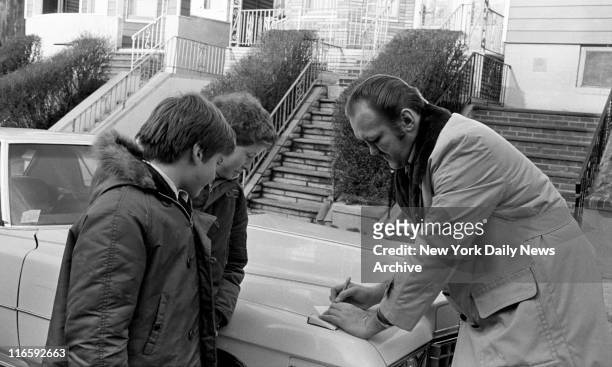 Chuck Wepner signs autographs for schoolkids outside his house in Bayonne\, New Jersey