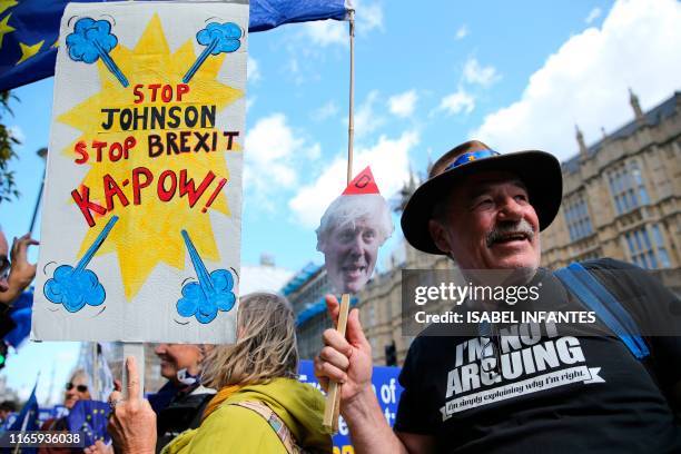 Anti-Brexit activists, and demonstrators opposing the British government's actions in relation to the handling of Brexit, gather outside the Houses...