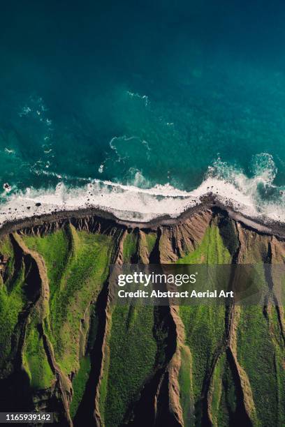 cliff edge and the atlantic ocean taken by drone, lanzarote - drone aerial stock-fotos und bilder