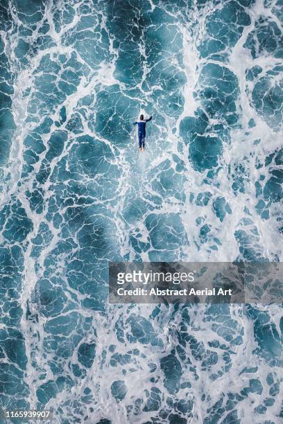 Surfer waiting for the big next wave shot by drone, Lanzarote