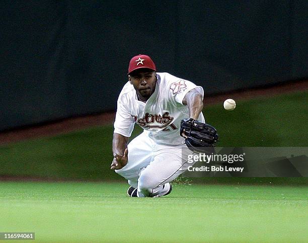 Center fielder Michael Bourn of the Houston Astros can't come up with the catch on a dropping line drive off the bat of Garrett Jones in the sixth...