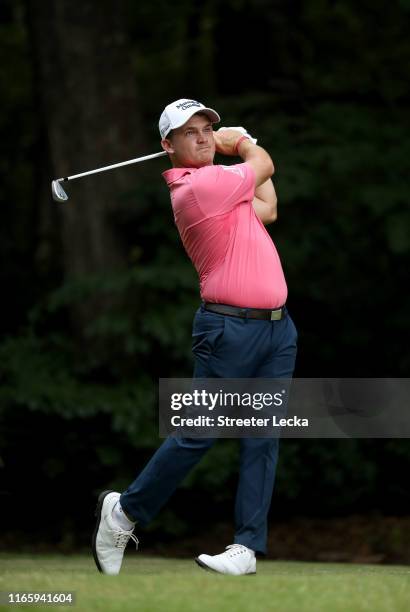 Bud Cauley hits a tee shot on the second hole during the third round of the Wyndham Championship at Sedgefield Country Club on August 03, 2019 in...
