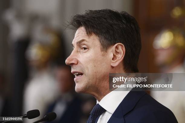 Italy's premier-designate Giuseppe Conte reads the list of his new cabinet after a meeting with Italian President, at the Rome's Quirinale...