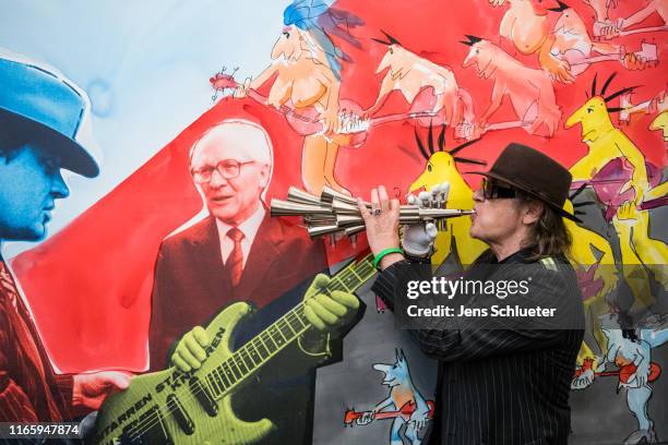 German singer Udo Lindenberg attends a photocall for the exhibition "Udo Lindenberg. Zwischentöne" at Museum der bildenden Kuenste Leipzig on...