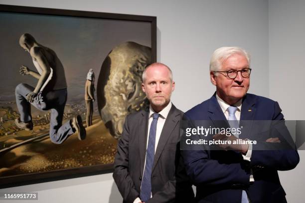 September 2019, North Rhine-Westphalia, Duesseldorf: Felix Krämer , Director of the Museum Kunstpalast, and Federal President Frank-Walter Steinmeier...