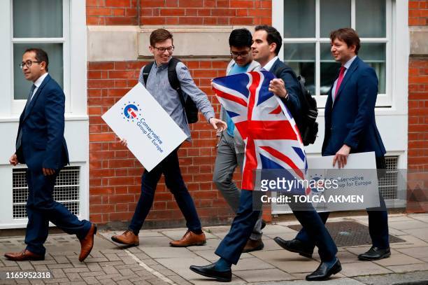 Young members of the Conservative Party arrive to protest their opposition to leaving the European Union with a deal outside the Conservative...