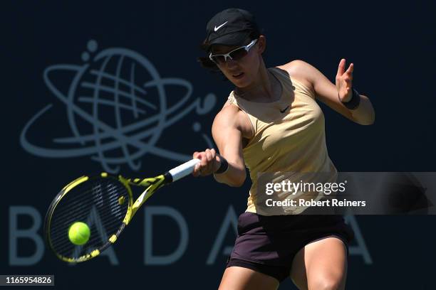 Saisai Zheng of China returns a shot to Maria Sakkari of Greece during their semifinal match in the Mubadala Silicon Valley Classic at the San José...