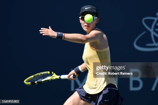 Saisai Zheng of China returns a shot to Maria Sakkari of Greece during their semifinal match in the Mubadala Silicon Valley Classic at the San José...