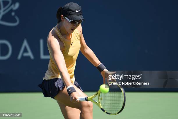 Saisai Zheng of China returns a shot to Maria Sakkari of Greece during their semifinal match in the Mubadala Silicon Valley Classic at the San José...
