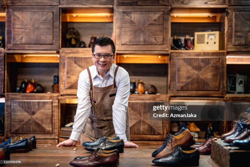 Confident Male Taiwanese Shoe Store Owner