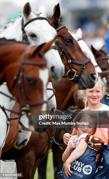 Mia Tindall looks over her shoulder at her soft toy horse as she attends day 2 of the 2019 Festival of British Eventing at Gatcombe Park on August 3,...