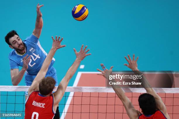 German Johansen of Argentina spikes during men´s volleyball semifinal match between Chile and Argentina at Polideportivo Callao of Villa Deportiva...