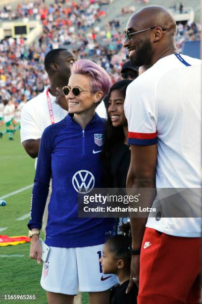 Megan Rapinoe of United States takes a photo with Gianna Byrant and Kobe Bryant before the first half against Republic of Ireland at the first game...