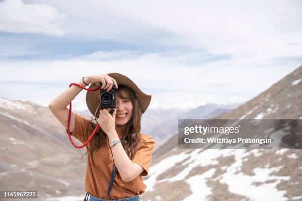 camera travel photo of photographer making pictures in hipster style glasses and hat - india tourism stock pictures, royalty-free photos & images