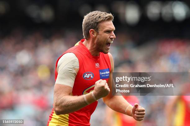 Sam Day of the Suns celebrates kicking a goal during the round 20 AFL match between the Collingwood Magpies and the Gold Coast Suns at Melbourne...