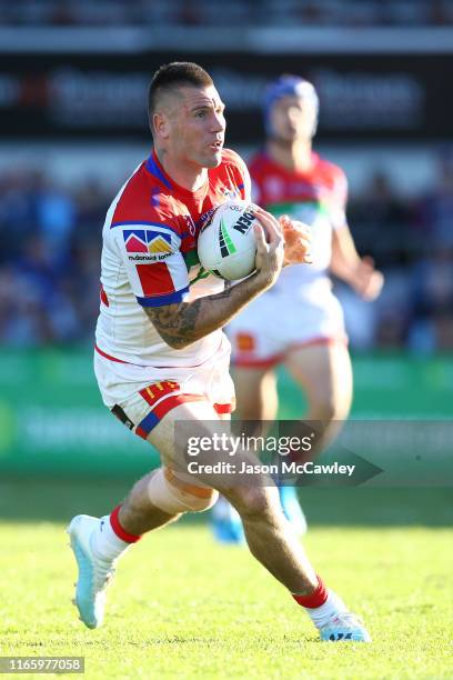 Shaun Kenny-Dowall of the Knights runs the ball during the round 20 NRL match between the Manly Sea Eagles and the Newcastle Knights at Lottoland on...