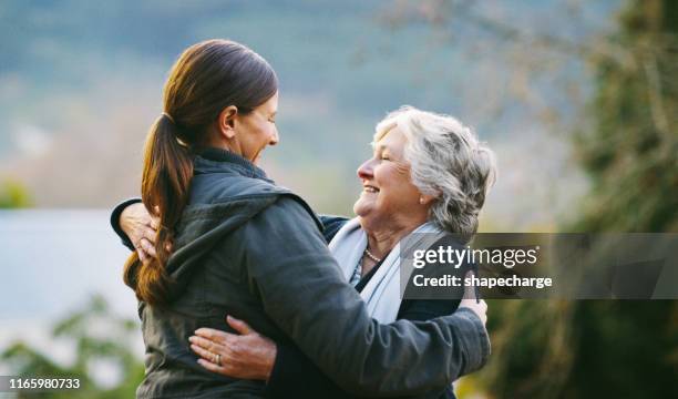 never too old to be mommy's little girl - young woman and senior lady in a park stock pictures, royalty-free photos & images