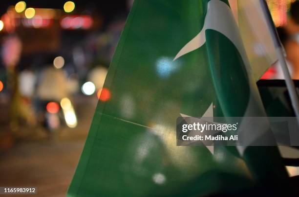 pakistan day independence or national day celebrations on the city streets, where crowd is motivated to join the parade and cheering with pakistan flags. - pakistan tehreek e insaf foto e immagini stock