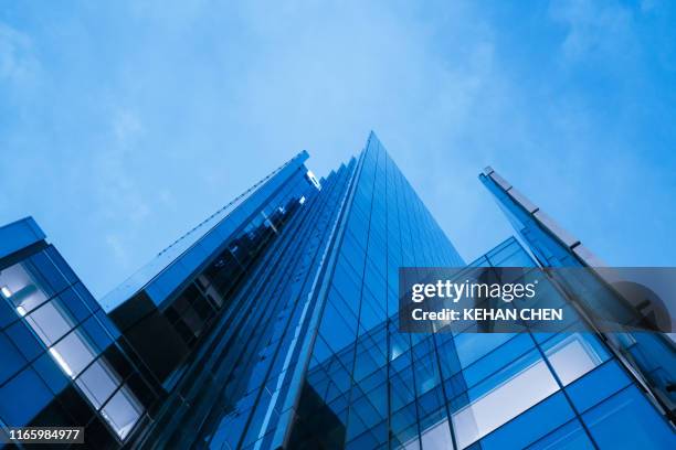 illuminated business office buildings  financial skyscrapers in central business district - bank building stockfoto's en -beelden