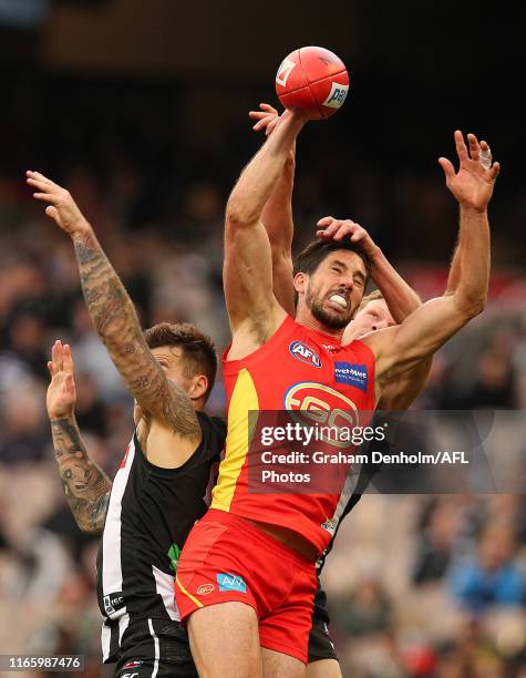 Michael Rischitelli of the Suns jumps for a mark during the round 20 AFL match between the Collingwood Magpies and the Gold Coast Suns at Melbourne...