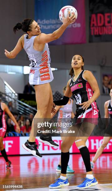 Ash Brazill of the Magpies catches in front of Maria Folau of the Thunderbirds during the round 11 Super Netball match between the Thunderbirds and...