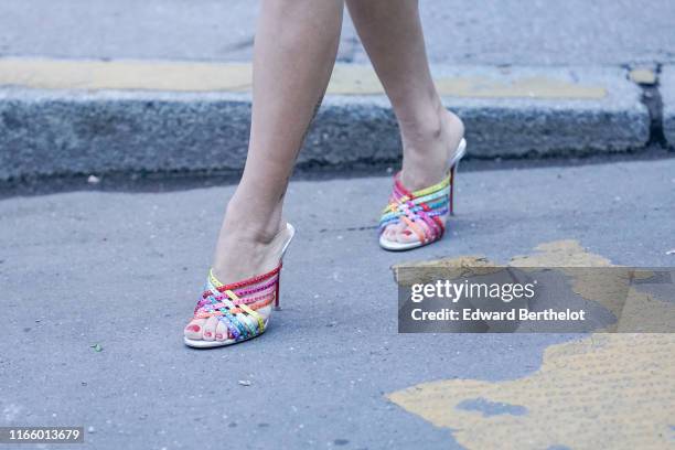 Guest wears colorful beaded heeled sandals, outside the "Scandal A Paris" : Jean-Paul Gaultier's New Fragance Launch Dinner Party At Lassere on April...