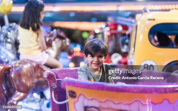 Little Kid Rides Carousel Cars Photos and Premium High Res Pictures - Getty Images