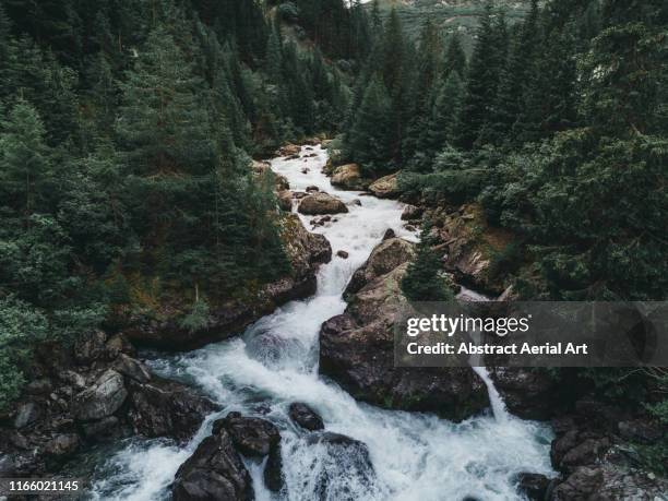 water flowing from lai da marmorera reservoir - sources stockfoto's en -beelden