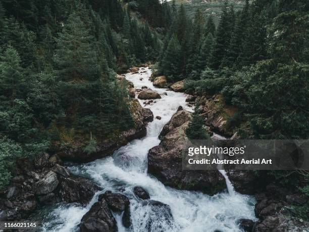 water flowing from lai da marmorera reservoir - river stock pictures, royalty-free photos & images