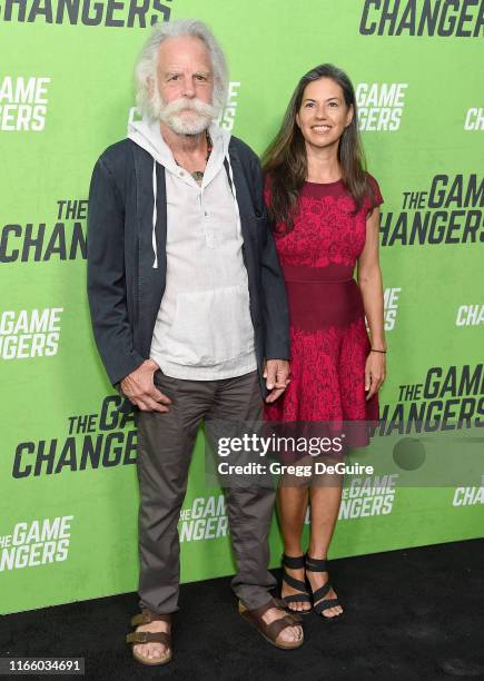 Bob Weir and Natascha Munter arrive at the LA Premiere Of "The Game Changers" at ArcLight Hollywood on September 4, 2019 in Hollywood, California.
