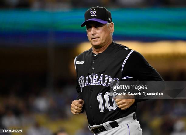 Manger Bud Black of the Colorado Rockies jogs back to the dugout after making a pitching change during the eight inning against against the Los...