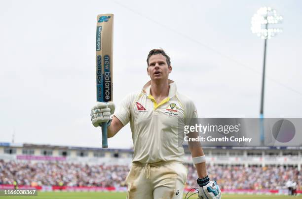 Steven Smith of Australia salutes the crowd as he leaves the field after being dismissed by Chris Woakes of England during day four of the 1st...