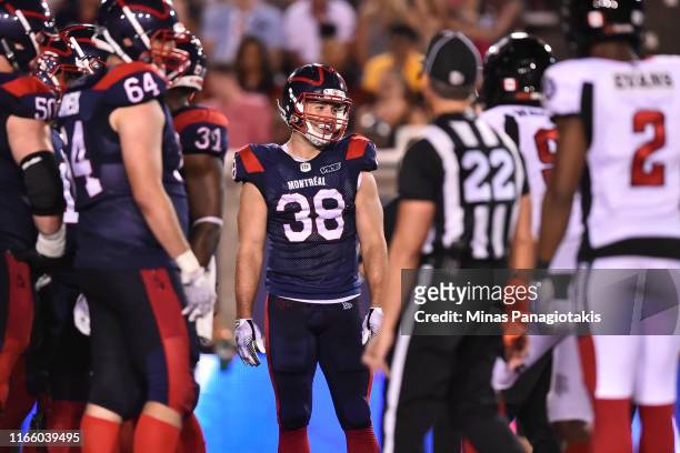 Fullback Christophe Normand of the Montreal Alouettes smiles against the Ottawa RedBlacks during the CFL game at Percival Molson Stadium on August 2,...