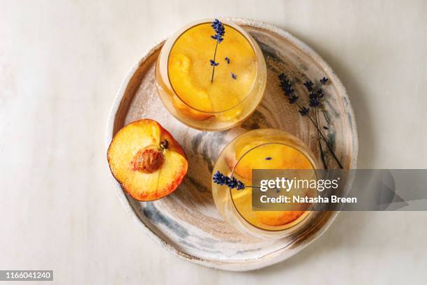 peach cocktail lemonade - bellini stock pictures, royalty-free photos & images