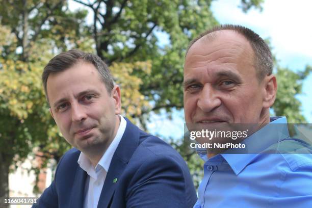 Wladysaw Kosiniak-Kamysz, the chairman of the Polish People's Party , and Pawel Kukiz, the leader of Kukiz'15 political party, pose for a picture...